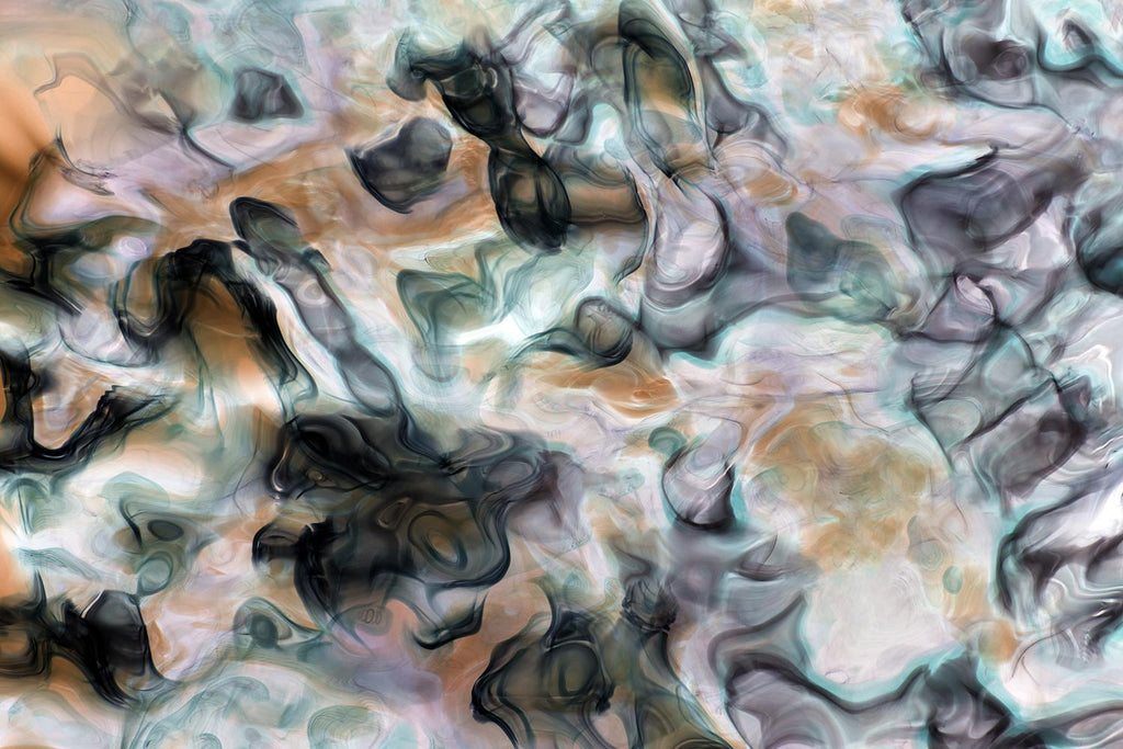 Abstract art with swirling colors in black, white, and gray.