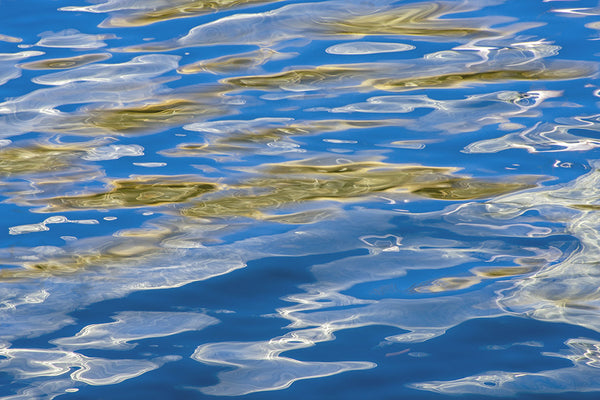 blue white and gold ocean artwork