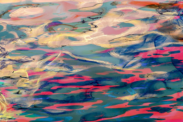 Abstract artwork with swirling colors on a textured  water surface
