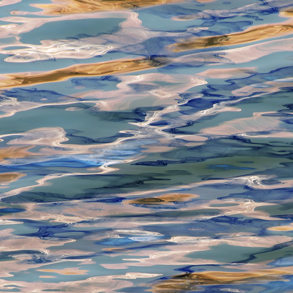 Colorful abstract reflections with blue, green, and brown tones.