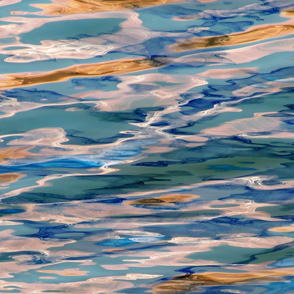 Colorful abstract reflections with blue, green, and brown tones.