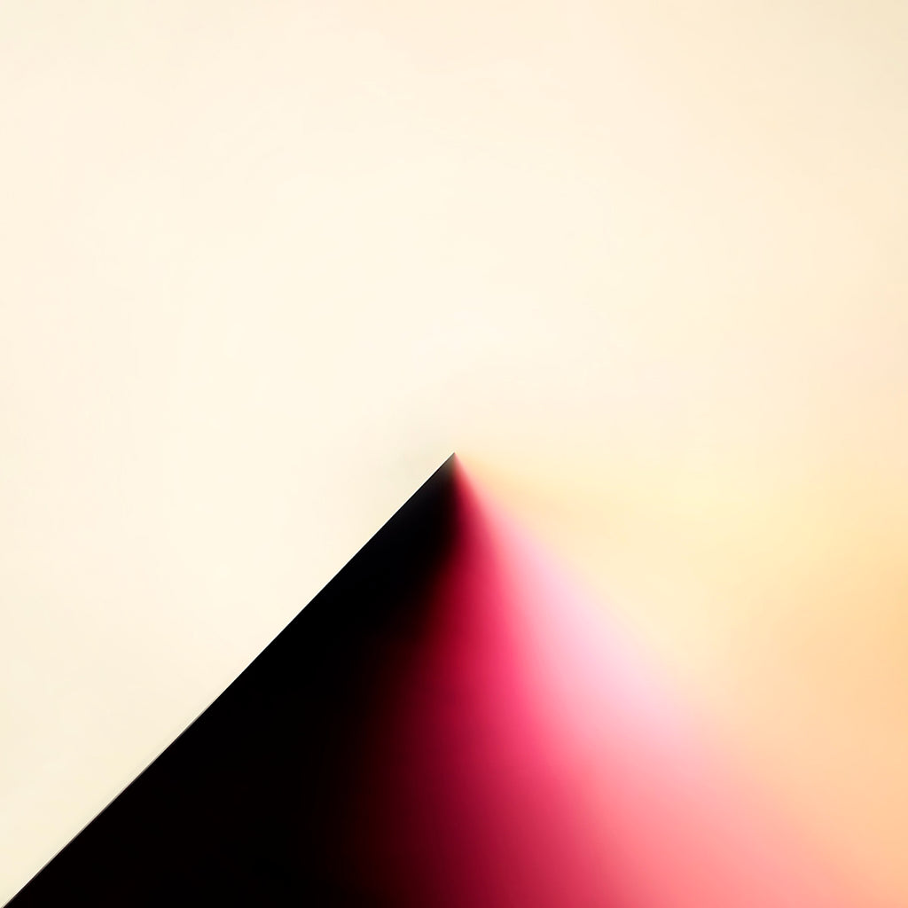 Abstract geometric art print featuring a sharp black triangular corner meeting a soft pink and peach gradient on a warm cream background.