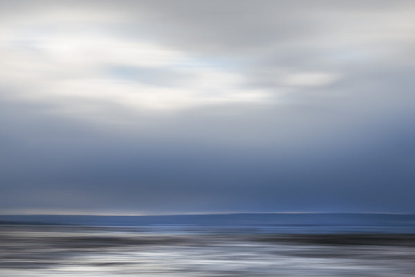 seascape art in blue with clouds
