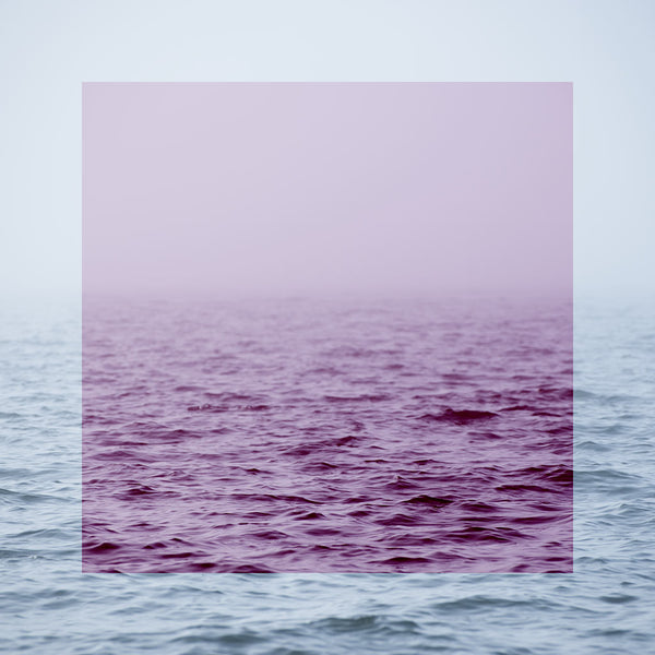 Gradient of purple and blue from top to bottom, with water at the bottom