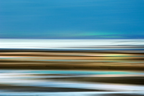 Abstract seascape with horizontal stripes in blue, white, and multicolor on a blue background