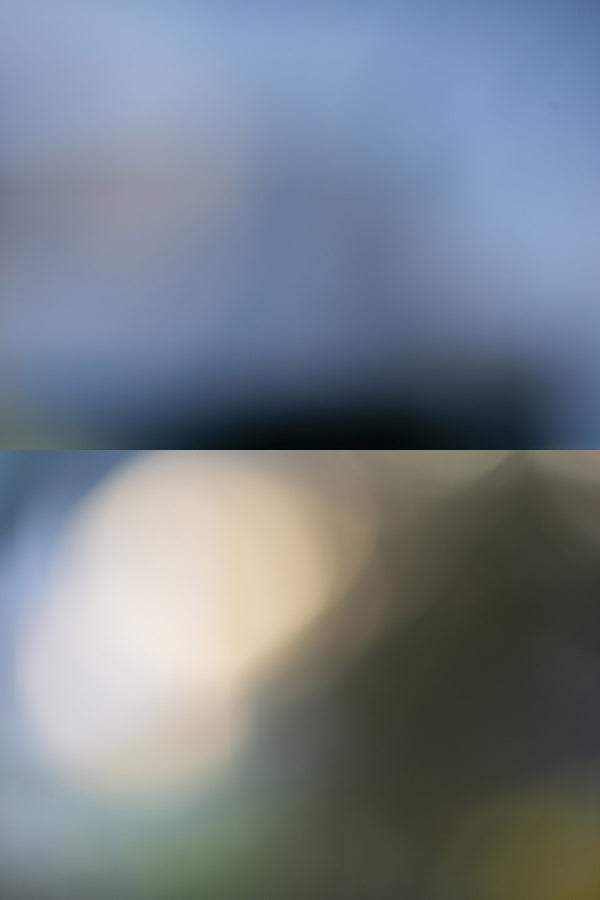 Blurred image with a dark top half and light bottom half
